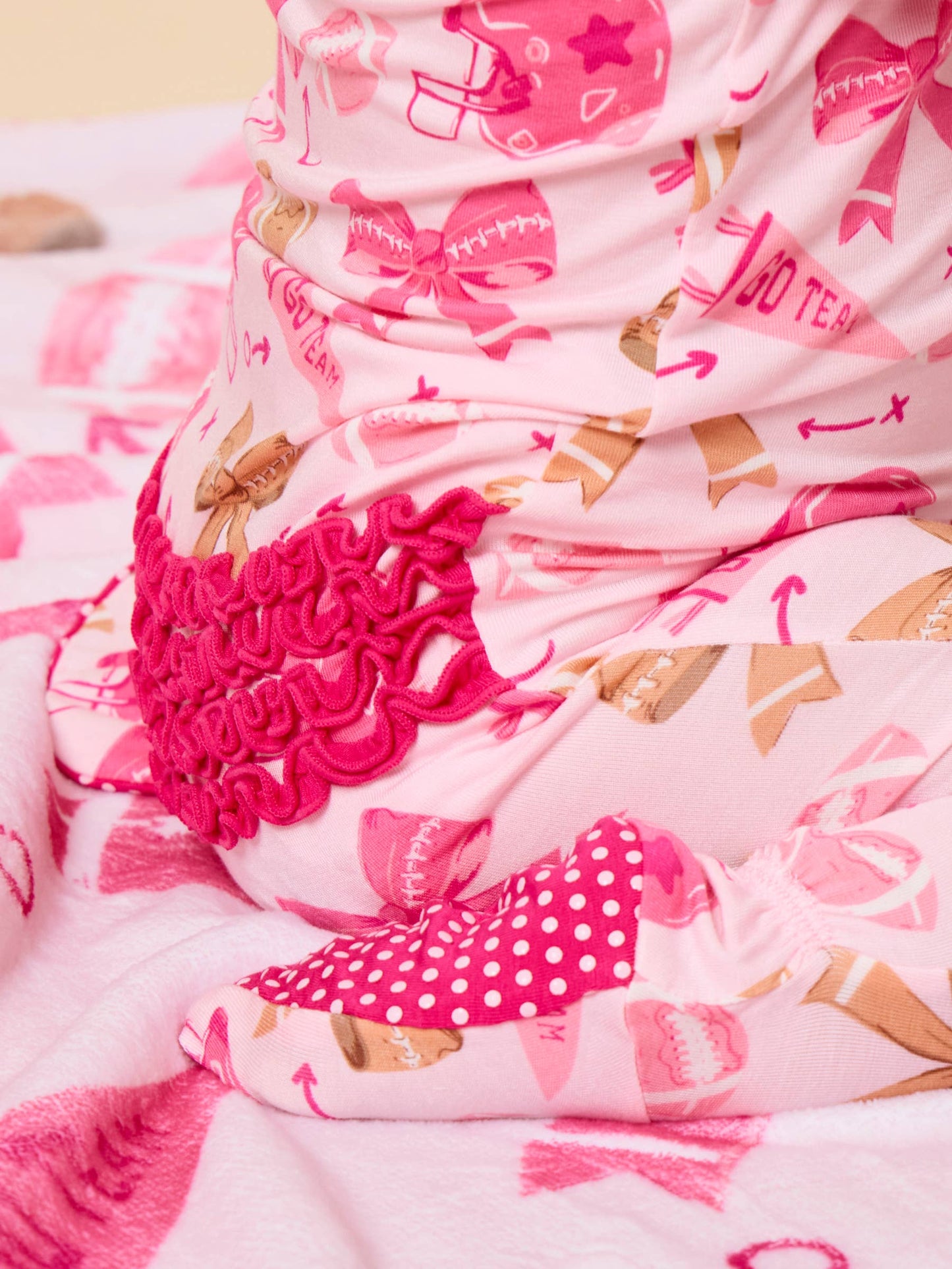 SoftSnooze™ Baby Girls Bamboo Viscose Footballs & Bows Footed Ruffle One Piece Pajama