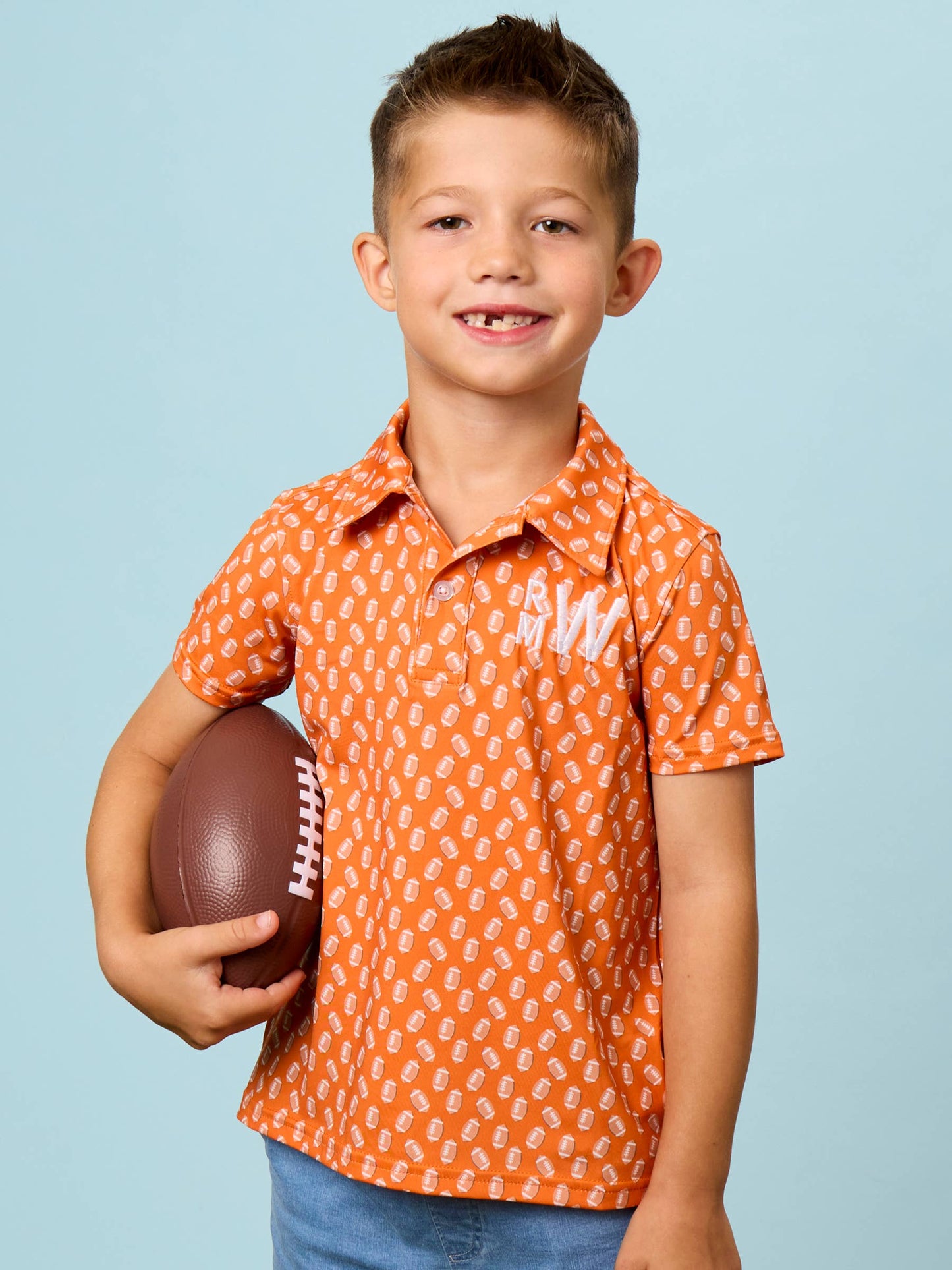 Boys Varsity Orange Football Frenzy Knit Short Sleeve Performance Polo