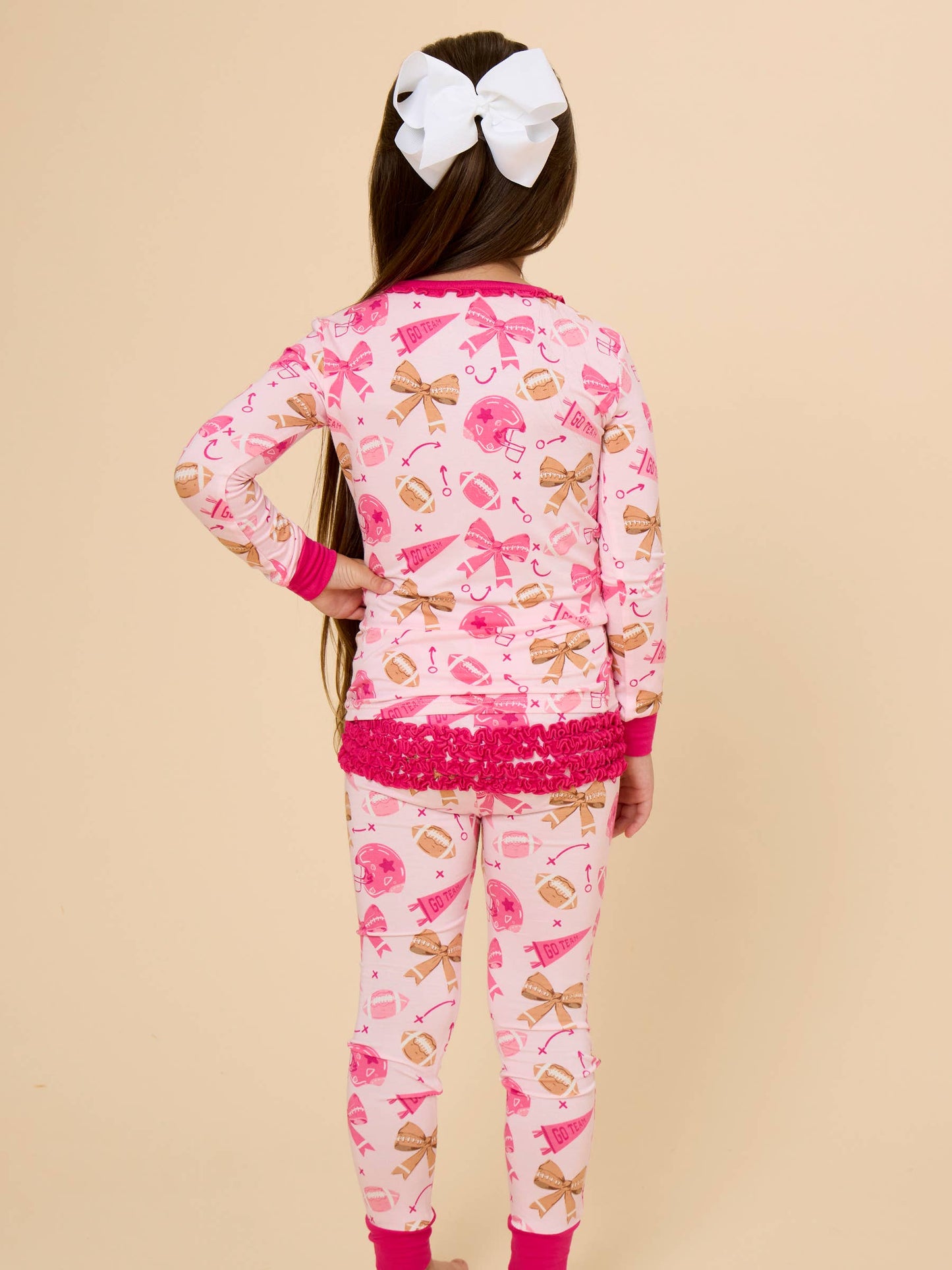 SoftSnooze™ Toddler Girls Bamboo Viscose Footballs & Bows Ruffle Long Sleeve Pajama Set with Signature Rear Ruffles