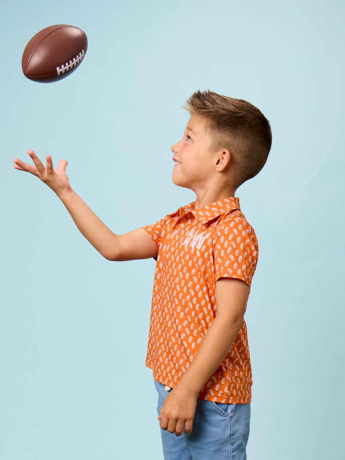 Boys Varsity Orange Football Frenzy Knit Short Sleeve Performance Polo
