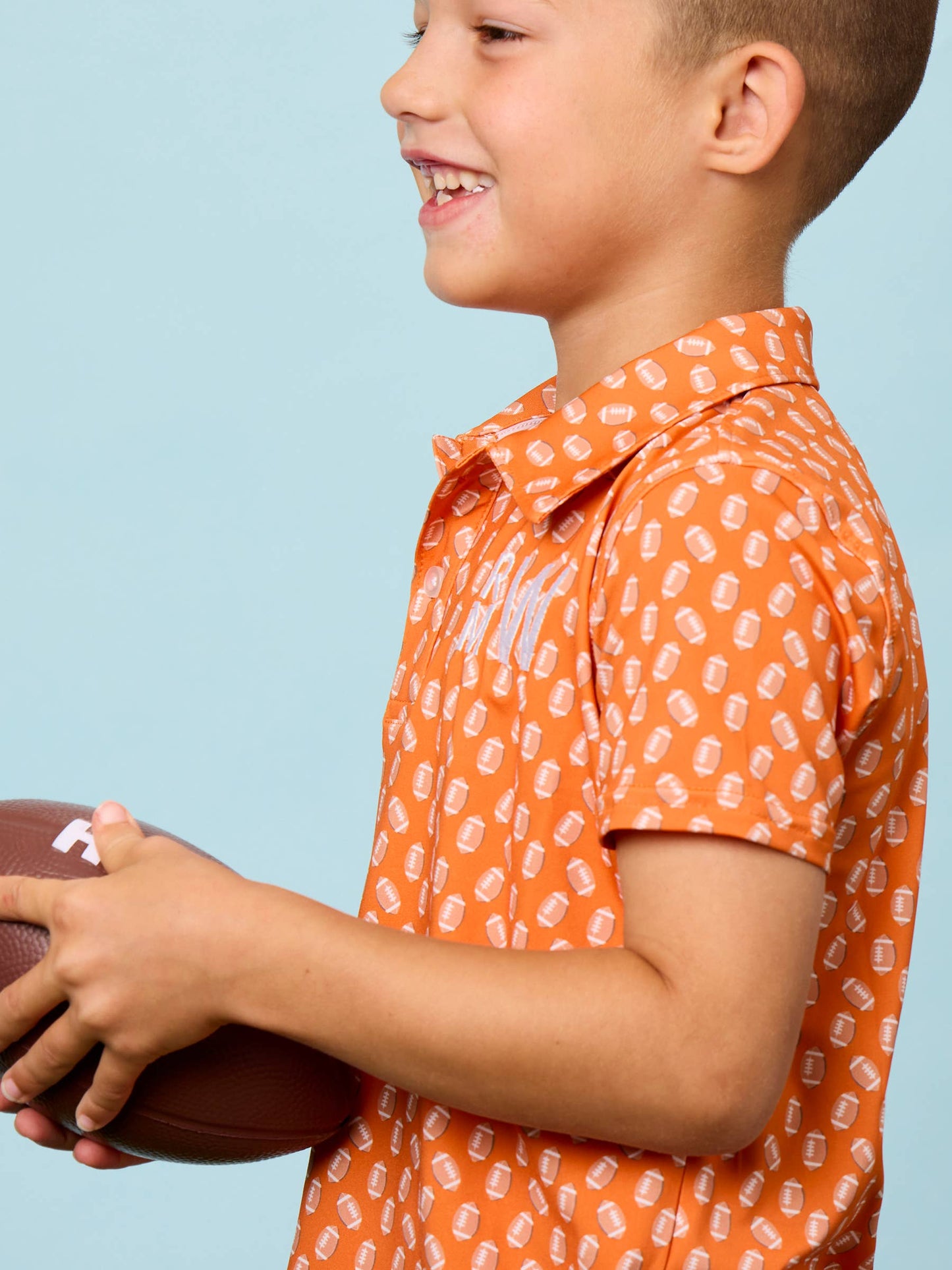 Boys Varsity Orange Football Frenzy Knit Short Sleeve Performance Polo