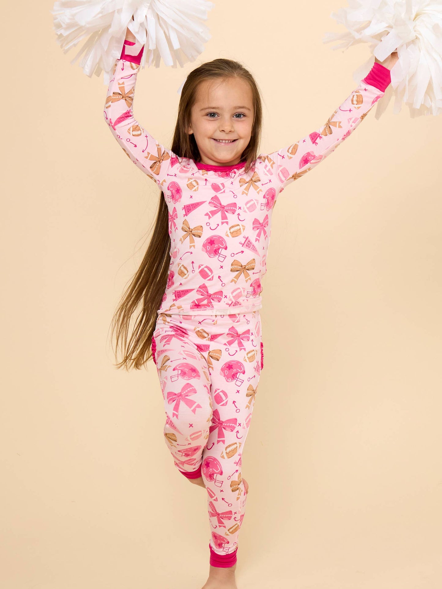 SoftSnooze™ Toddler Girls Bamboo Viscose Footballs & Bows Ruffle Long Sleeve Pajama Set with Signature Rear Ruffles