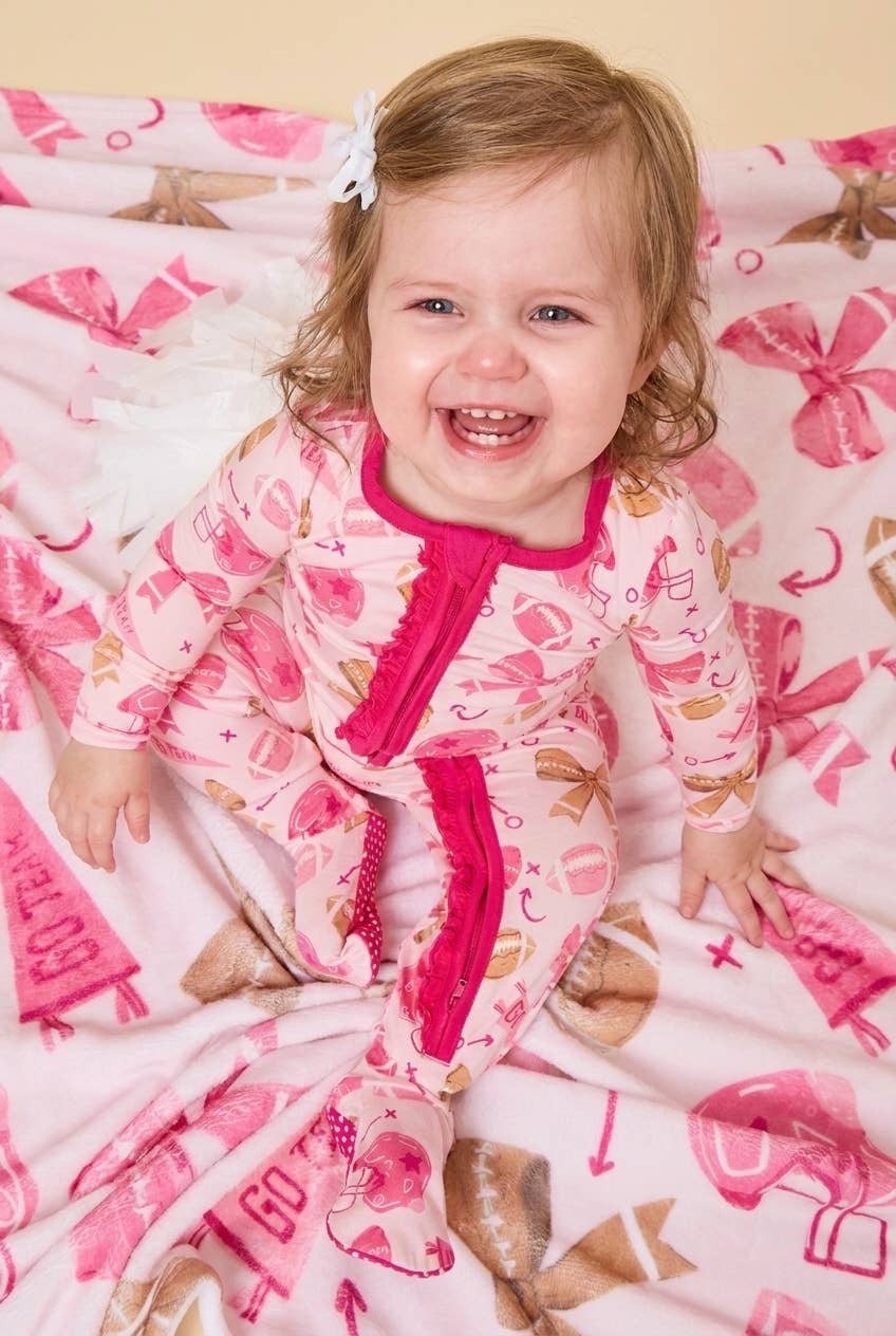 SoftSnooze™ Baby Girls Bamboo Viscose Footballs & Bows Footed Ruffle One Piece Pajama