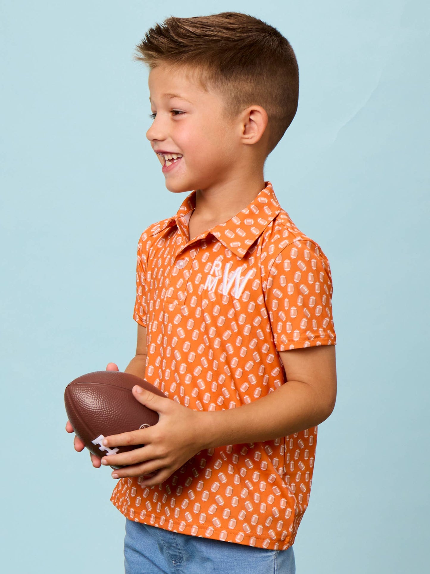 Boys Varsity Orange Football Frenzy Knit Short Sleeve Performance Polo