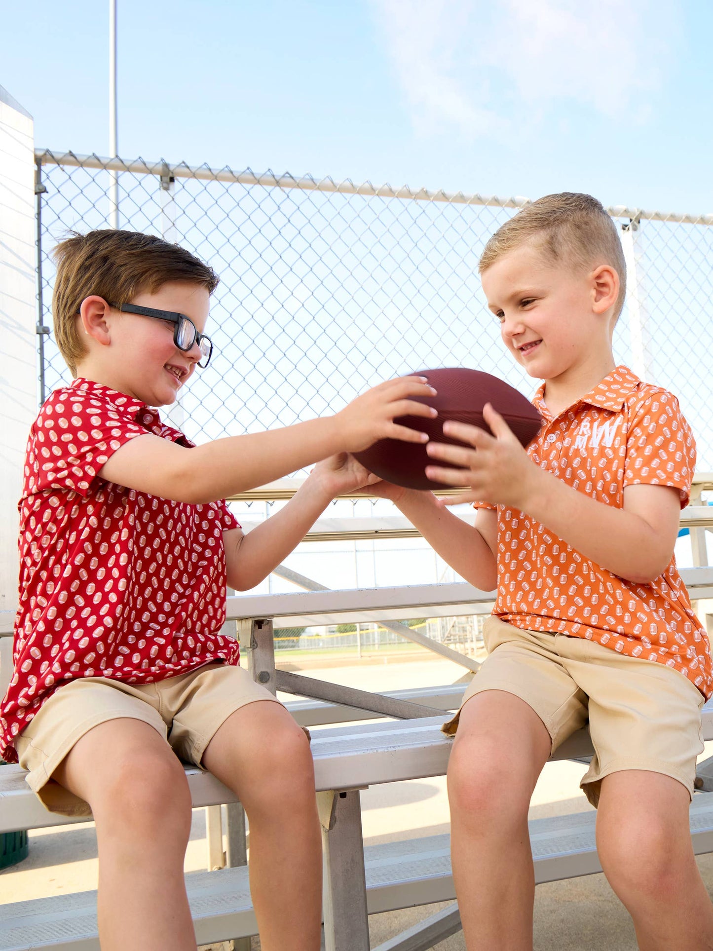 Boys Varsity Orange Football Frenzy Knit Short Sleeve Performance Polo