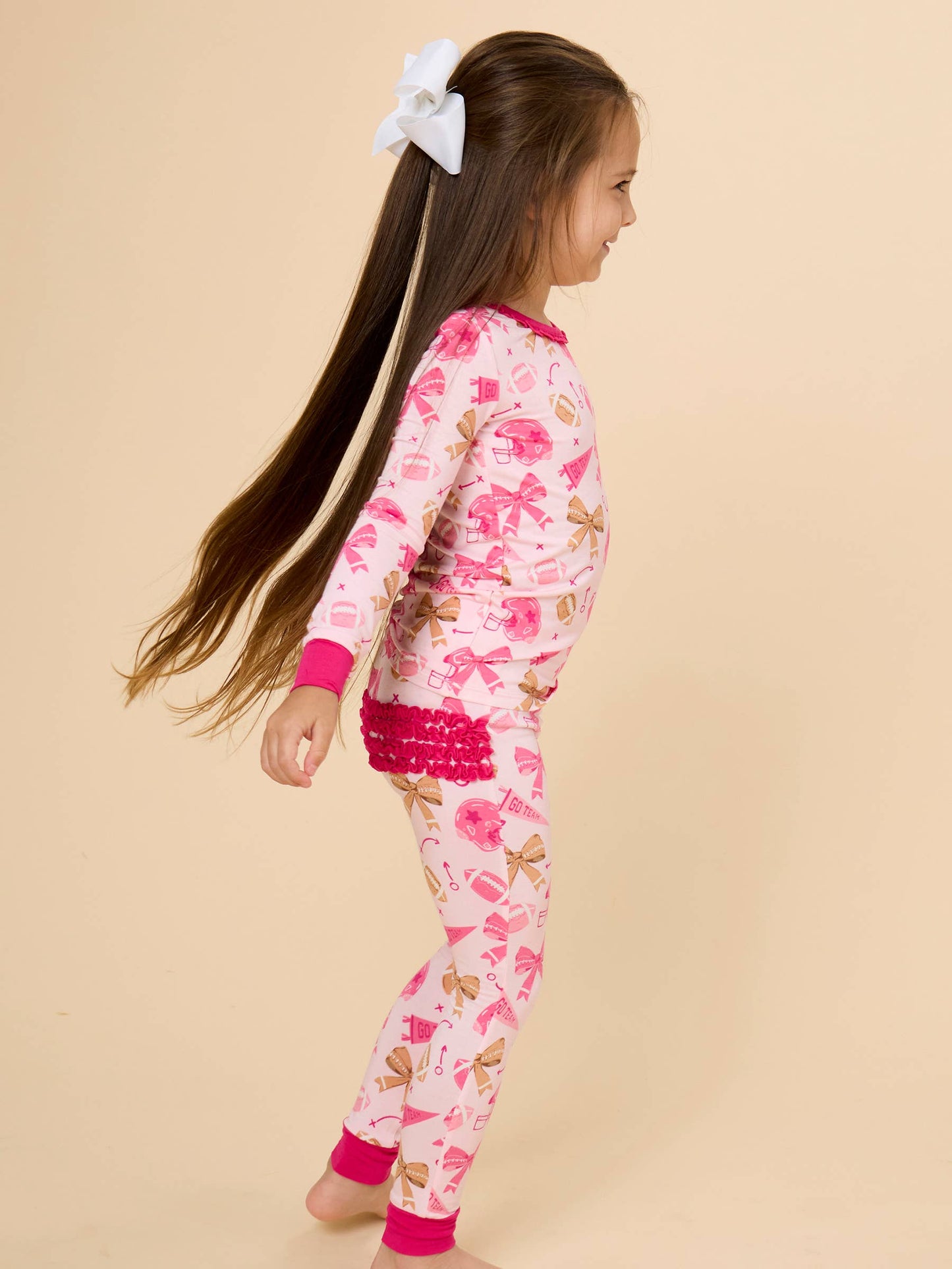 SoftSnooze™ Toddler Girls Bamboo Viscose Footballs & Bows Ruffle Long Sleeve Pajama Set with Signature Rear Ruffles